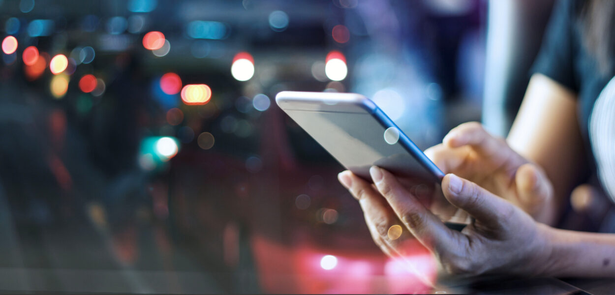 feature01 User scrolling through their digital banking app on their phone.