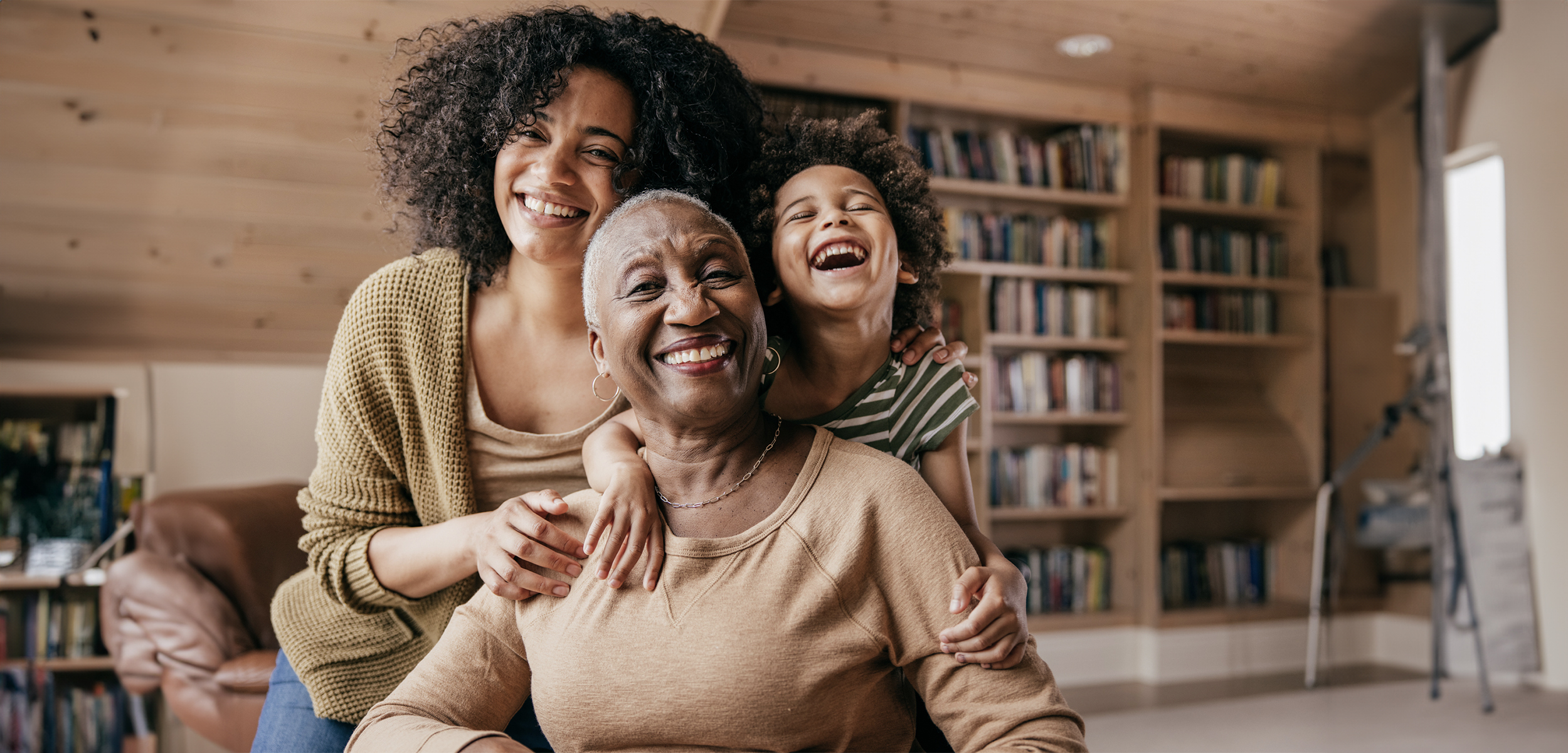 A family of three posing for a photo