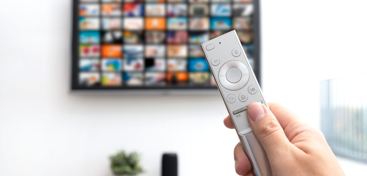 Multimedia video streaming concept Multimedia video streaming concept. Television set, remote control in hand