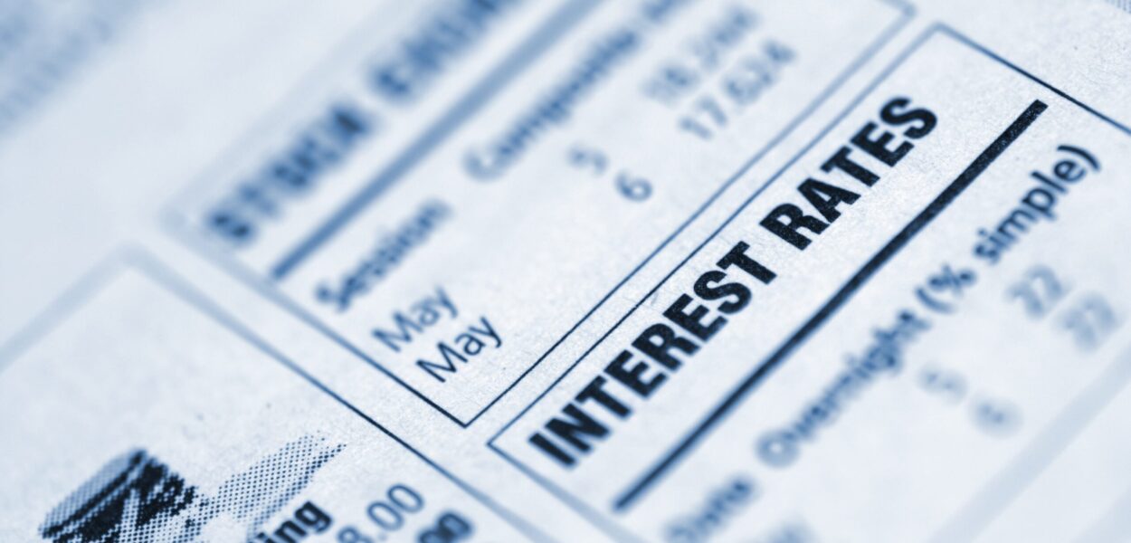 Small box in a newspaper containing interest rates info Closeup of "interest rates" text in a newspaper