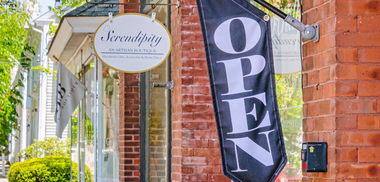 North Kingstown, Rhode Island, USA -May 22, 2024-  A  small unique shop  along Main Street in Wickford, Rhode Island disaplays some of its merchandise on the sidewalk on a bright May Afternoon.