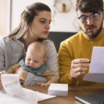 Young family with baby worried about family budget