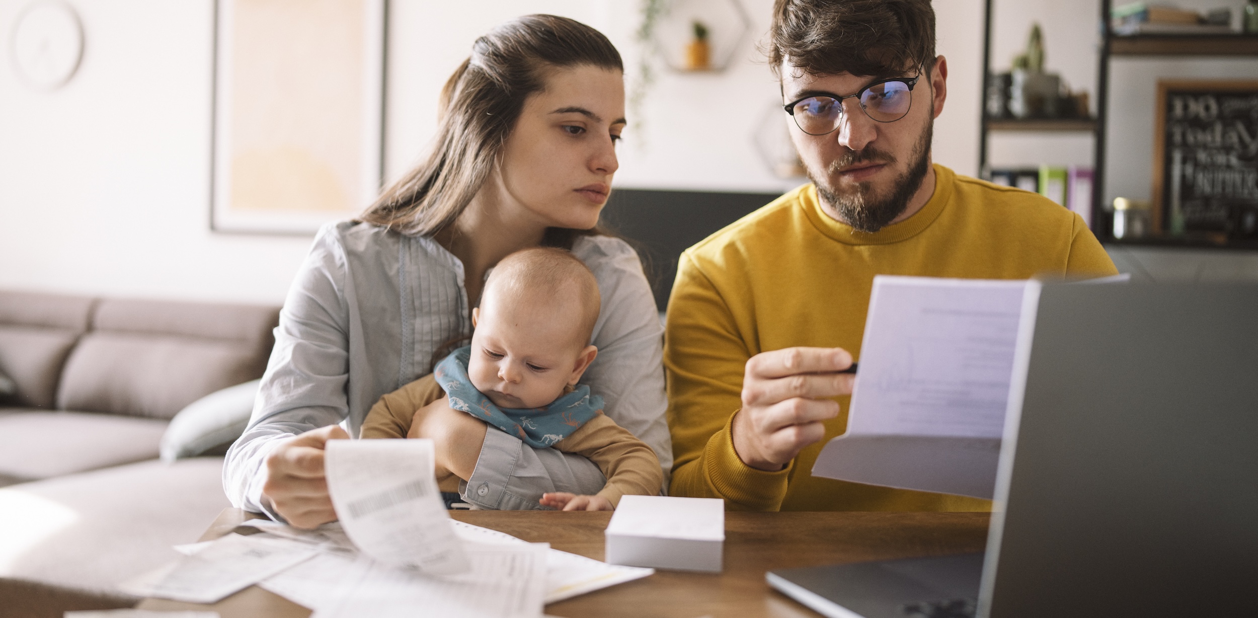 Young family with baby worried about family budget