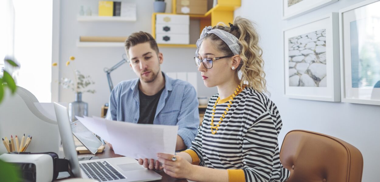 A couple reviewing finances in a home office