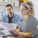 A couple reviewing finances in a home office